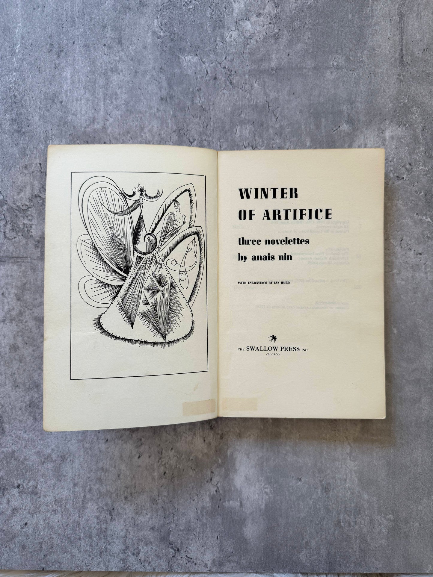 Open book with text and illustration on a gray surface. Winter of Artifice: Three Novelettes by Anais Nin. Shop for new and used books with The Stone Circle, the only online bookstore near you in Nevada City, California.